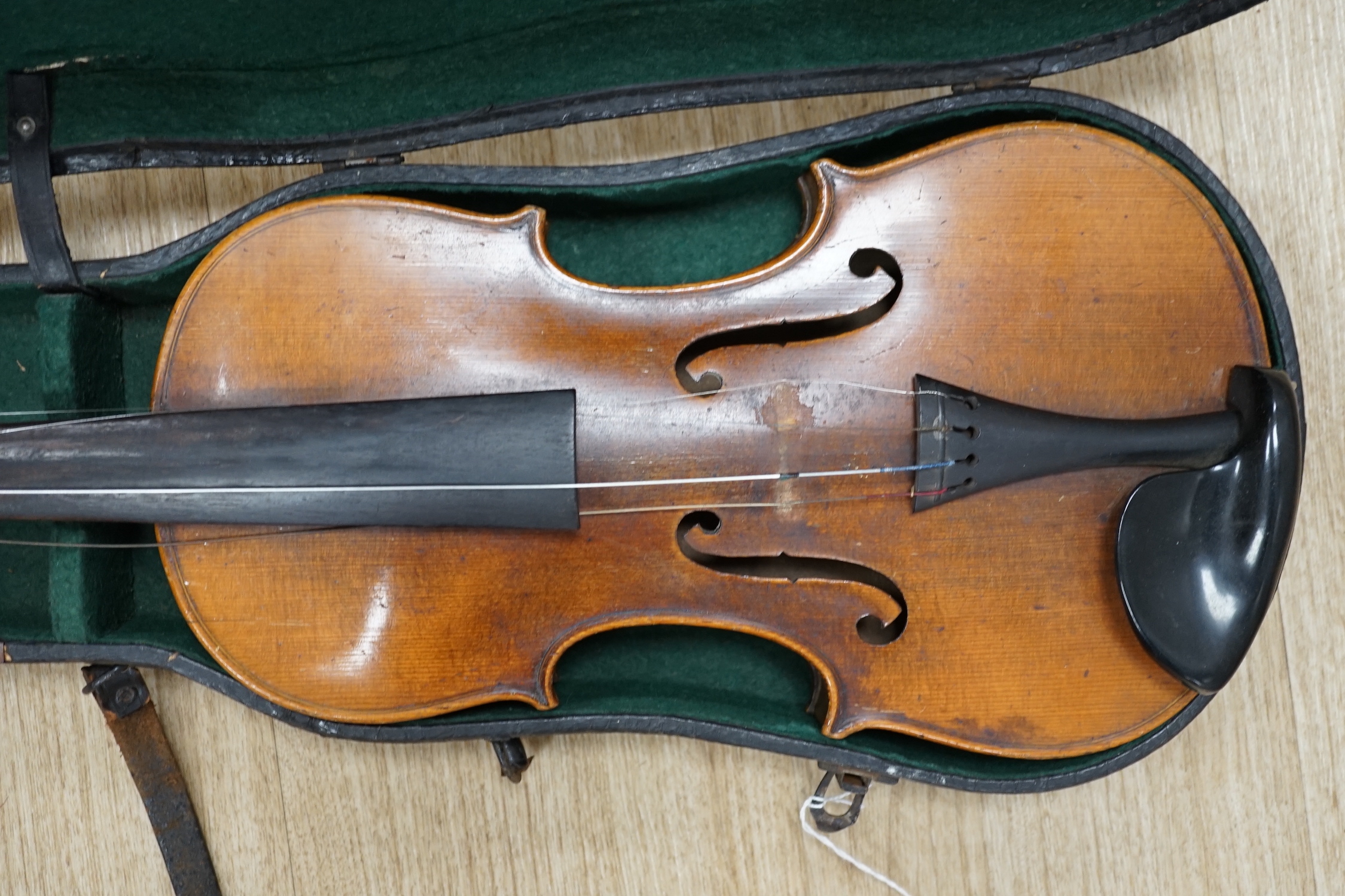 A cased early 20th century violin, length of body, 35.5cm, without bow